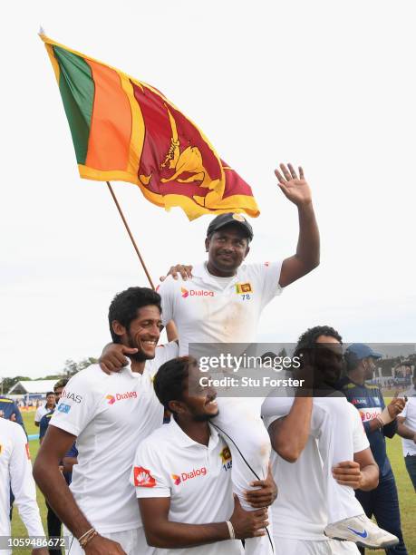 Sri Lanka player Rangana Herath is chairlifted around the pitch by team mates after his final Test Match after Day Four of the First Test match...