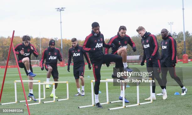 Marcus Rashford and Matteo Darmian of Manchester United in action during a first team training session at Aon Training Complex on November 9, 2018 in...