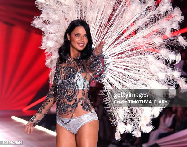 Brazilian model Adriana Lima walks the runway at the 2018 Victoria's Secret Fashion Show on November 8, 2018 at Pier 94 in New York City. - Every...