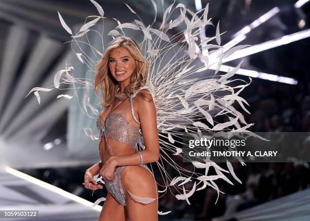 Swedish model Elsa Hosk walks the runway past Halsey as she performs at the 2018 Victoria's Secret Fashion Show on November 8, 2018 at Pier 94 in New...