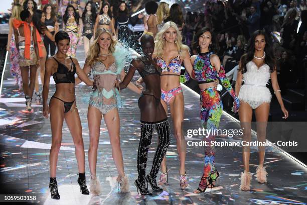 Models Jourdana Phillips, Megan Williams, Grace Bol, Devon Windsor, Liu Wen, and Gizele Oliveira walk the runway at the 2018 Victoria's Secret...