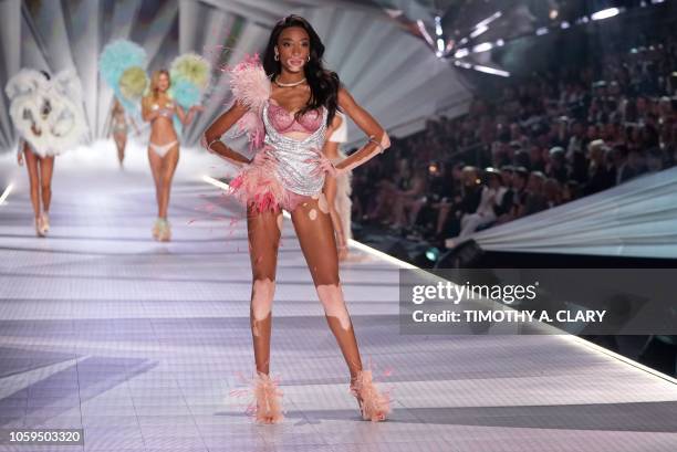 Canadian model Winnie Harlow walks the runway at the 2018 Victoria's Secret Fashion Show on November 8, 2018 at Pier 94 in New York City. - Every...