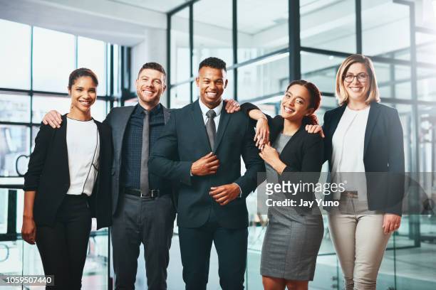 teamwork makes success happen - businesswear stock pictures, royalty-free photos & images