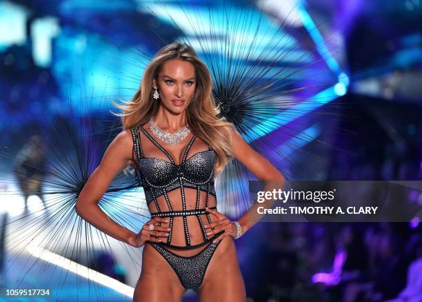 South African model Candice Swanepoel walks the runway at the 2018 Victoria's Secret Fashion Show on November 8, 2018 at Pier 94 in New York City. -...