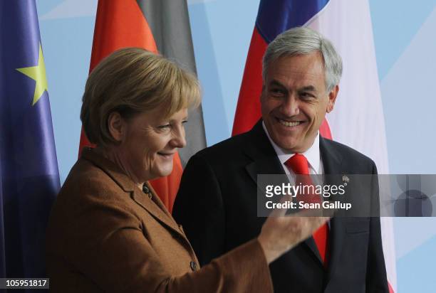 German Chancellor Angela Merkel and Chilean President Sebastian Pinera prepare to depart after speaking to the media following bilateral talks at the...