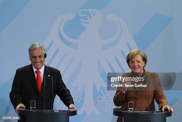 German Chancellor Angela Merkel and Chilean President Sebastian Pinera speak to the media following bilateral talks at the Chancellery on October 22,...