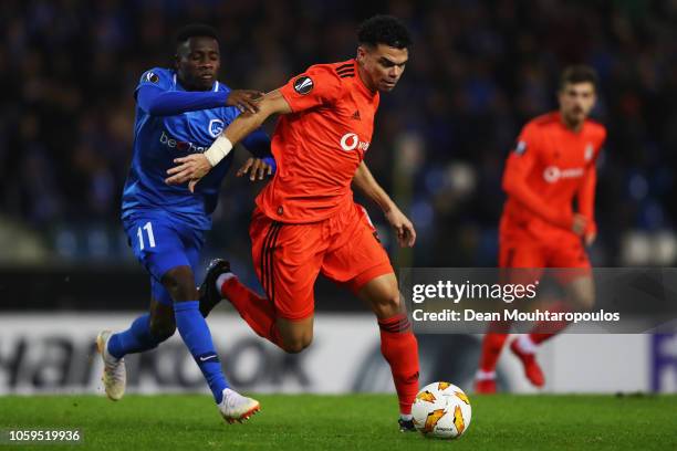 Pepe of Besiktas evades Joseph Paintsil of KRC Genk during the UEFA Europa League Group I match between KRC Genk and Besiktas at Cristal Arena on...