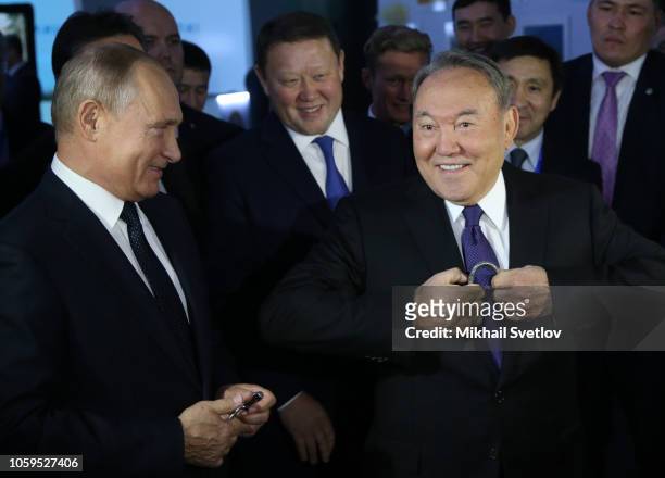 Russian President Vladimir Putin and Kazakh President Nursultan Nazarbayev attend a tourist exhibition during the 15th Forum of Interregional...
