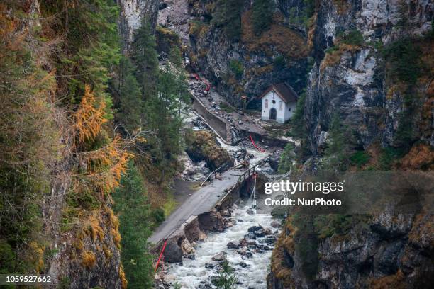 The old Church of Rocca Pietore, italian Dolomites, Belluno Province, with the Serrai di Sottoguda destroyed and torn by bad weather on 7 November...