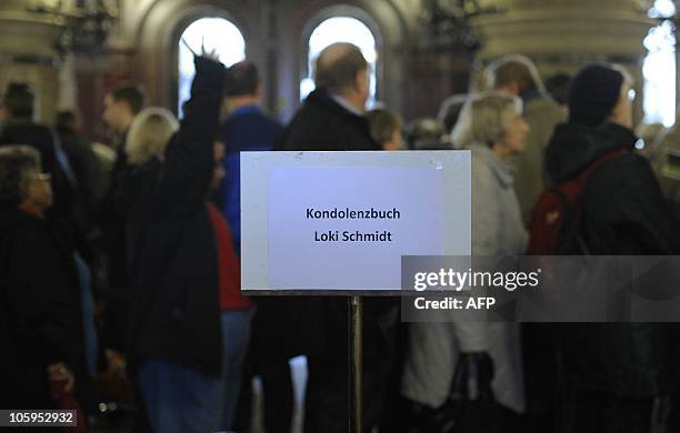 Citizens line up to sign a book of condolence for Hannelore "Loki" Schmidt at the City Hall of Hamburg, northern Germany, on October 22, 2010....