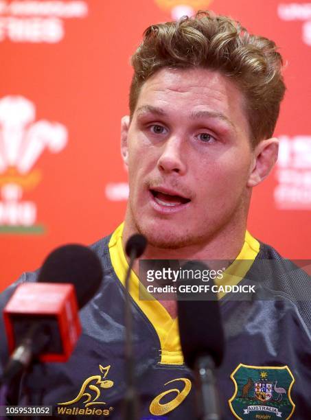 Australia's flanker Michael Hooper speaks during a press conference following the captain's run training session at the Principality stadium in...