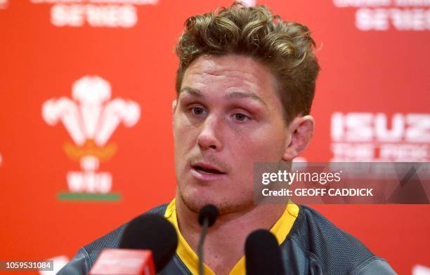 Australia's flanker Michael Hooper speaks during a press conference following the captain's run training session at the Principality stadium in...