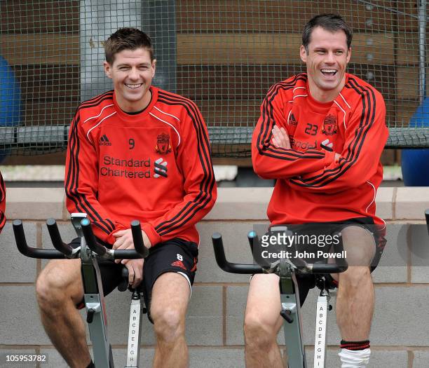 Steven Gerrard and Jamie Carragher of Liverpool attend a Liverpool FC training session at Melwood training Ground on October 22, 2010 in Liverpool,...