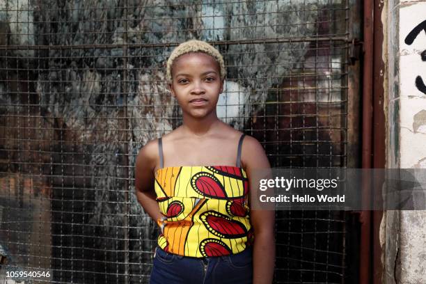 Portrait of young woman with African print top