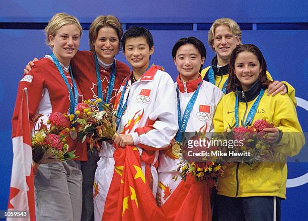 Xue Sang and Na Li of China win gold in the Womens Synchronised 10m Platform Diving beating silver medallists Anne Montminy and Emile Heymans of...
