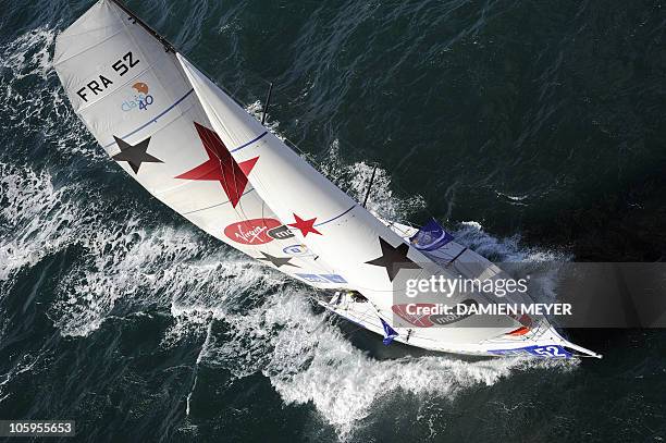 French skipper Damien Seguin sails on his monohull "Des pieds et des mains" on October 20, 2010 off the coast of Saint-Malo, western France, prior to...