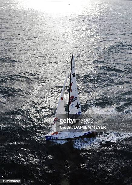 French skipper Damien Seguin sails on his monohull "Des pieds et des mains" on October 20, 2010 off the coast of Saint-Malo, western France, prior to...