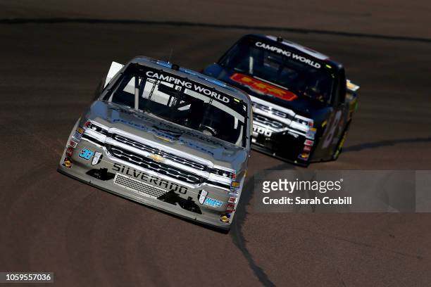 Landon Huffman, driver of the Arizona Department of Public Safety Chevrolet, leads John Hunter, driver of the Hostetler Ranch/Stonefield Home...