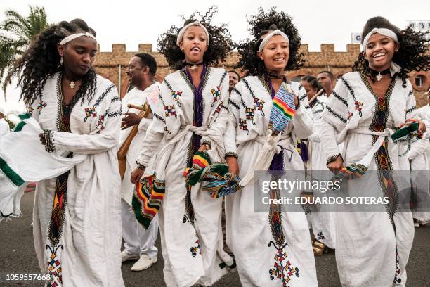 Women dance as they wait for the arrival of Eritrea's President at the airport in Gondar, nothern Ethiopia, on November 9, 2018. The president of...