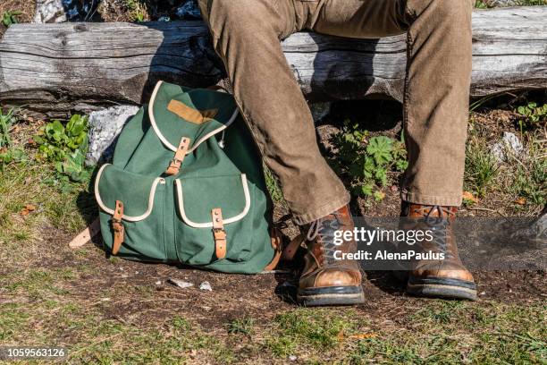 backpack and mountain shoes close up - beautiful legs in high heels stock pictures, royalty-free photos & images