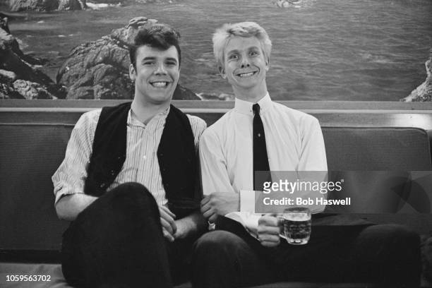 English singers and musicians Marty Wilde and Joe Brown pictured together during production of the film 'What a Crazy World' in England on 2nd May...