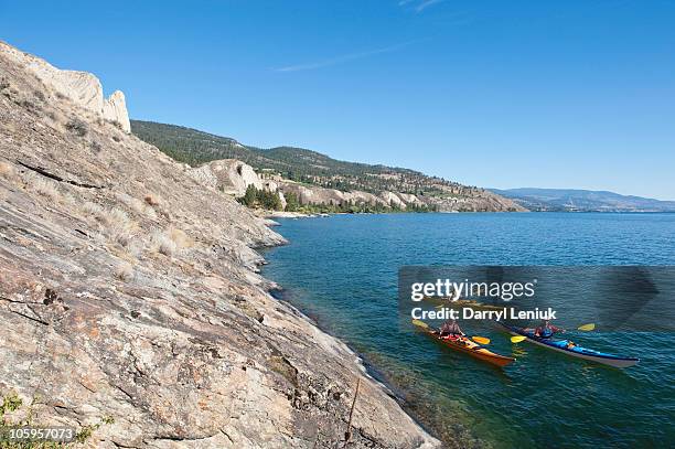 sea kayakers - okanagan valley stock pictures, royalty-free photos & images