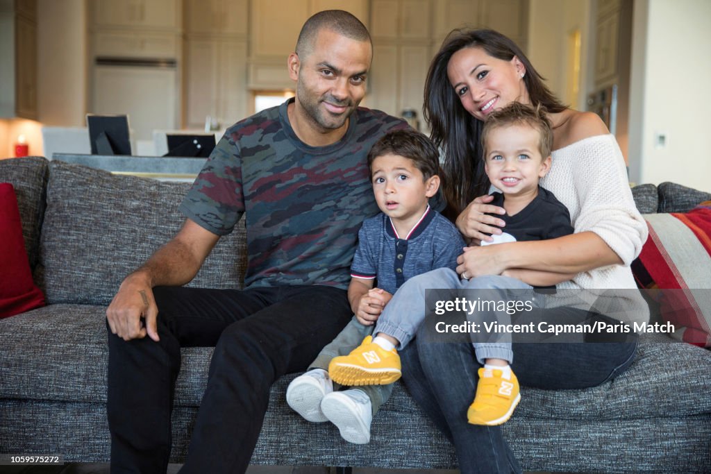 Basketball player Tony Parker with his wife Axelle and their sons