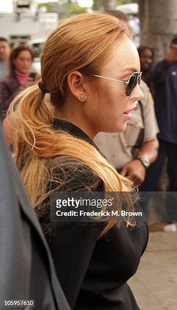 Lindsay Lohan leaves the Beverly Hills courthouse after attending a probation violation hearing for failing a drug test ordered by the court in...