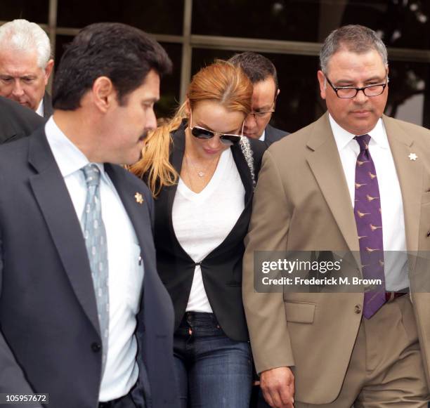 Lindsay Lohan leaves the Beverly Hills courthouse after attending a probation violation hearing for failing a drug test ordered by the court in...