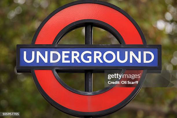 The London Underground roundel, designed by Edward Johnston in 1918, is displayed at the entrance to Westminster station on October 22, 2010 in...