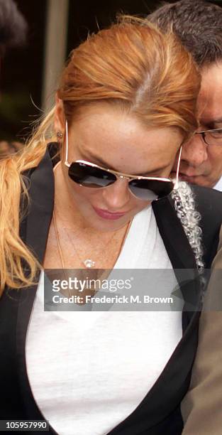 Lindsay Lohan leaves the Beverly Hills courthouse after attending a probation violation hearing for failing a drug test ordered by the court in...