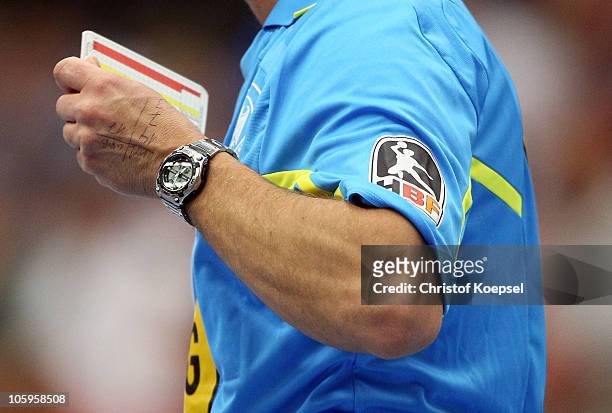 Referee puts out his card to write down notices during the Toyota Handball Bundesliga match between HSG Ahlen-Hamm and THW Kiel at the Maxipark Arena...