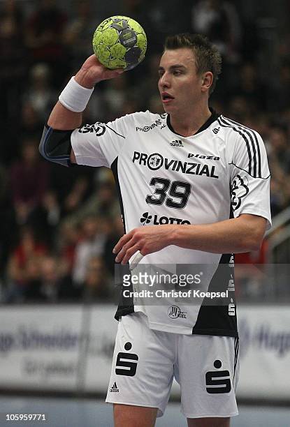 Filip Jicha of Kiel passes the ball during the Toyota Handball Bundesliga match between HSG Ahlen-Hamm and THW Kiel at the Maxipark Arena on October...