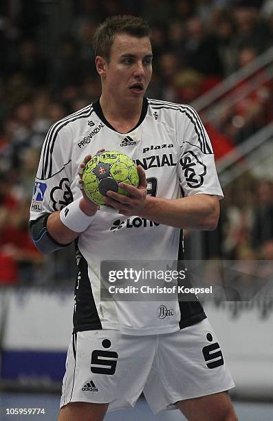 Filip Jicha of Kiel passes the ball during the Toyota Handball Bundesliga match between HSG Ahlen-Hamm and THW Kiel at the Maxipark Arena on October...