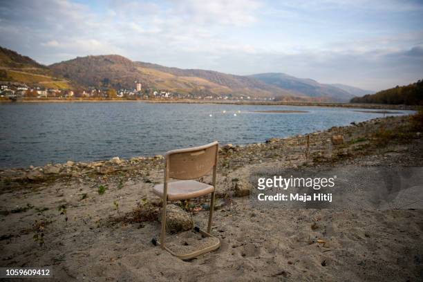 Chair is placed near the Rhine River on November 09, 2018 near Lorch in Germany. Summer heat wave in Germany as well unfavorable wind conditions, and...
