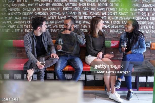 a group of friends enjoying some wine. - stellenbosch wine stock pictures, royalty-free photos & images