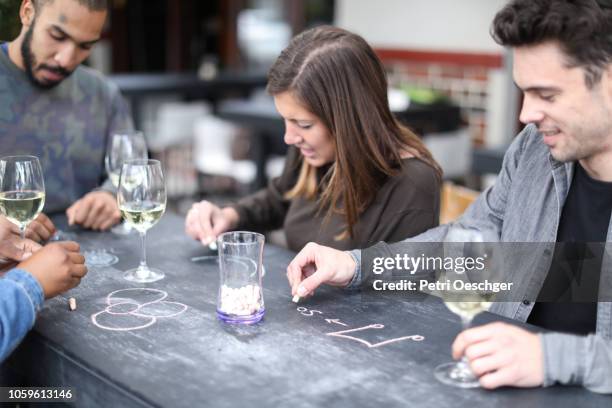 a group of friends enjoying some wine. - stellenbosch wine bildbanksfoton och bilder