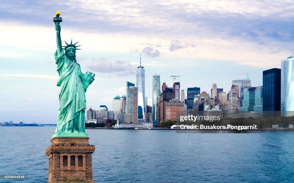 The statue of Liberty with World Trade Center background, Landmarks of New York City