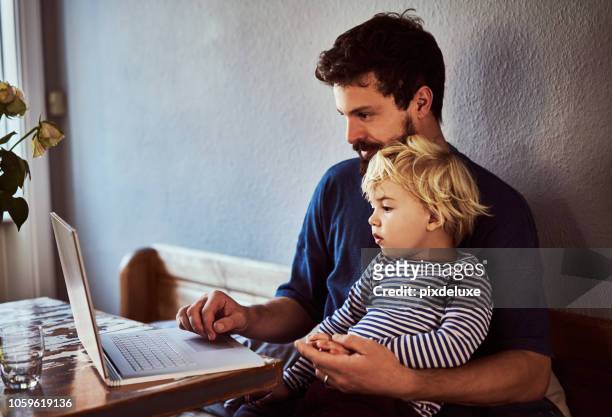 he wants to be just like his dad - using laptop stock pictures, royalty-free photos & images