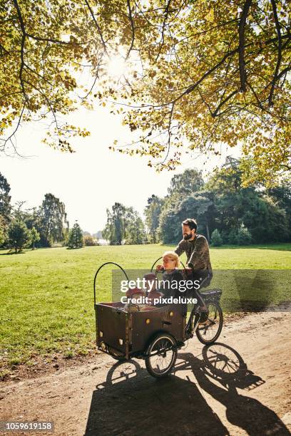 taking his family around the park - summer denmark stock pictures, royalty-free photos & images