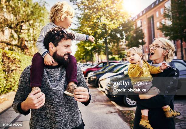 taking in the city sights - carrying-a-person-on-shoulders stock pictures, royalty-free photos & images