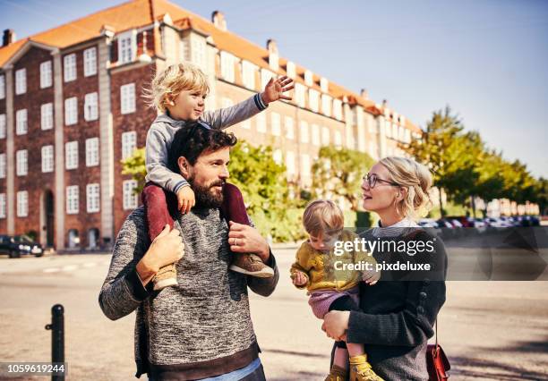 that way! - carrying-a-person-on-shoulders stock pictures, royalty-free photos & images