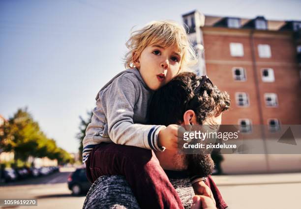 the bond between father and son - carrying on shoulders stock pictures, royalty-free photos & images