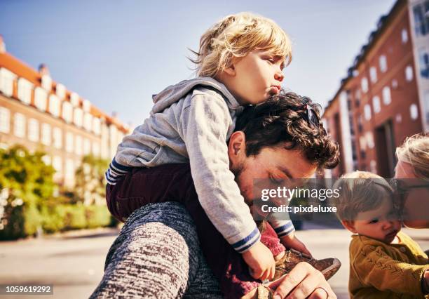 affection runs deep in this family - brother sister stock pictures, royalty-free photos & images