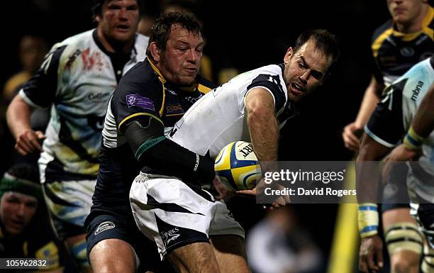 Charlie Hodgson of Sale is tackled by Steve Thompson during the Aviva Premiership match between Leeds Carnegie and Sale Sharks at Headingley Carnegie...