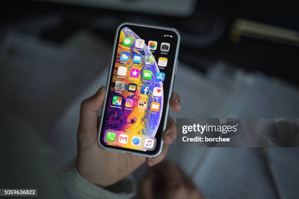 iphone xs with protective case - apple computers stock pictures, royalty-free photos & images