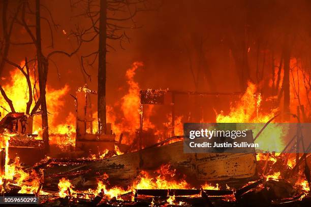 Home burns as the Camp Fire moves through the area on November 9, 2018 in Magalia, California. Fueled by high winds and low humidity, the rapidly...