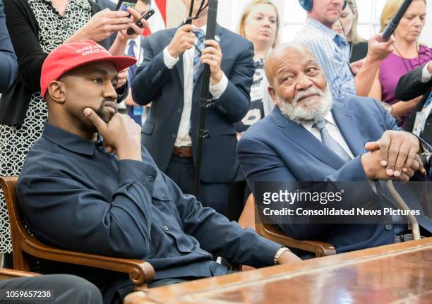 View of American rapper and producer Kanye West and retired professional football player Jim Brown, in the White House's Oval Office, Washington DC,...
