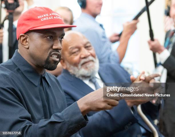 View of American rapper and producer Kanye West, pointing with one finger, in the White House's Oval Office, Washington DC, October 11, 2018. He...