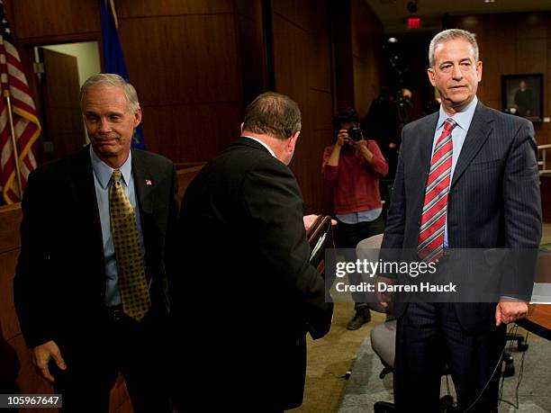 Senator Russ Feingold and Republican candidate Ron Johnson leave the stage after they took part in the Senatorial debate held at Marquette University...